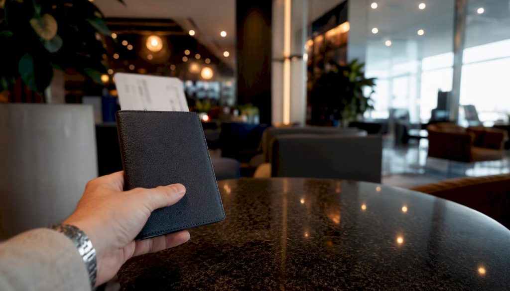 Traveler holding passport at airport border control