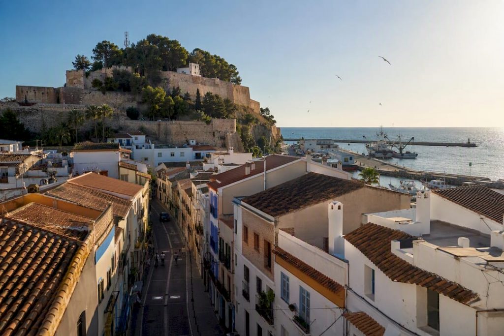 Panoramic view of Denia town with castle and marina