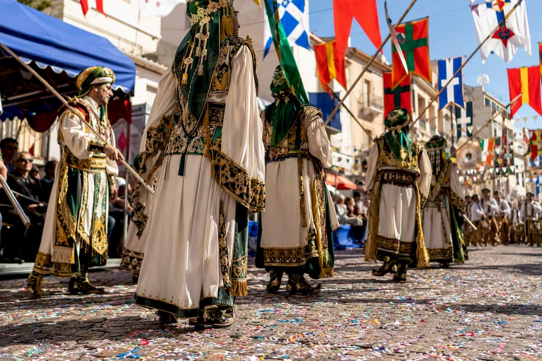 Festival procession with colorful costumes in Calpe old town