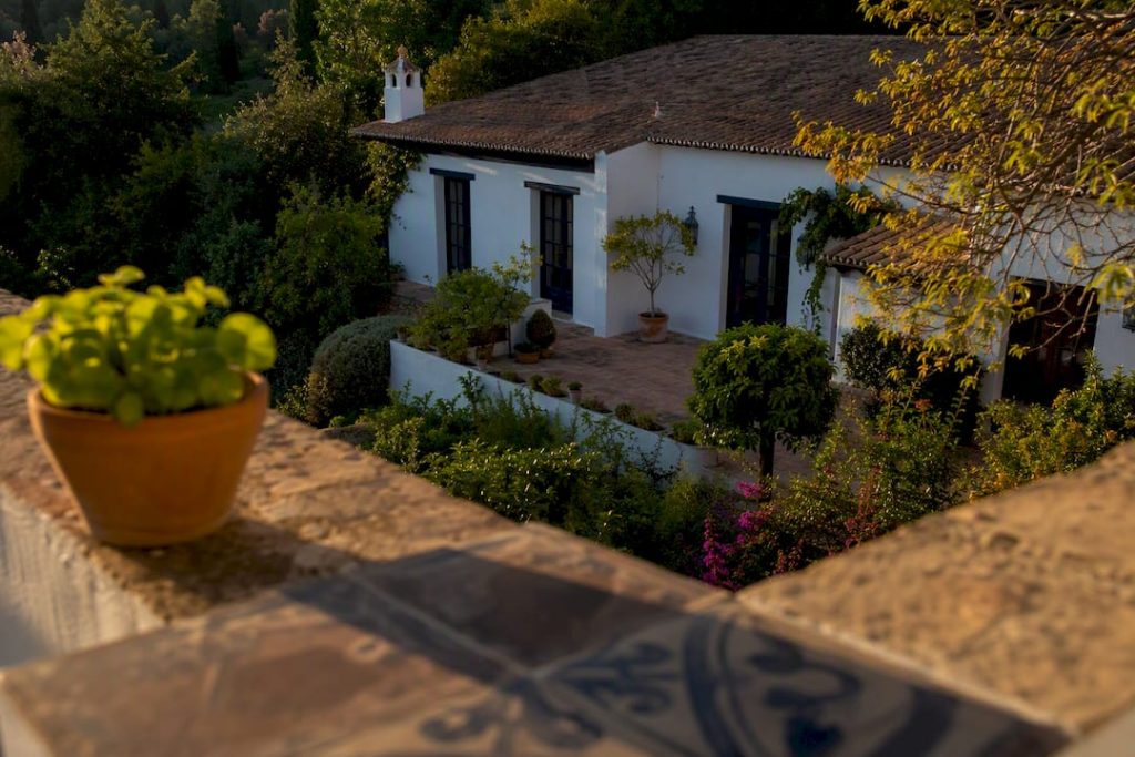 Spanish villa exterior with property papers and keys