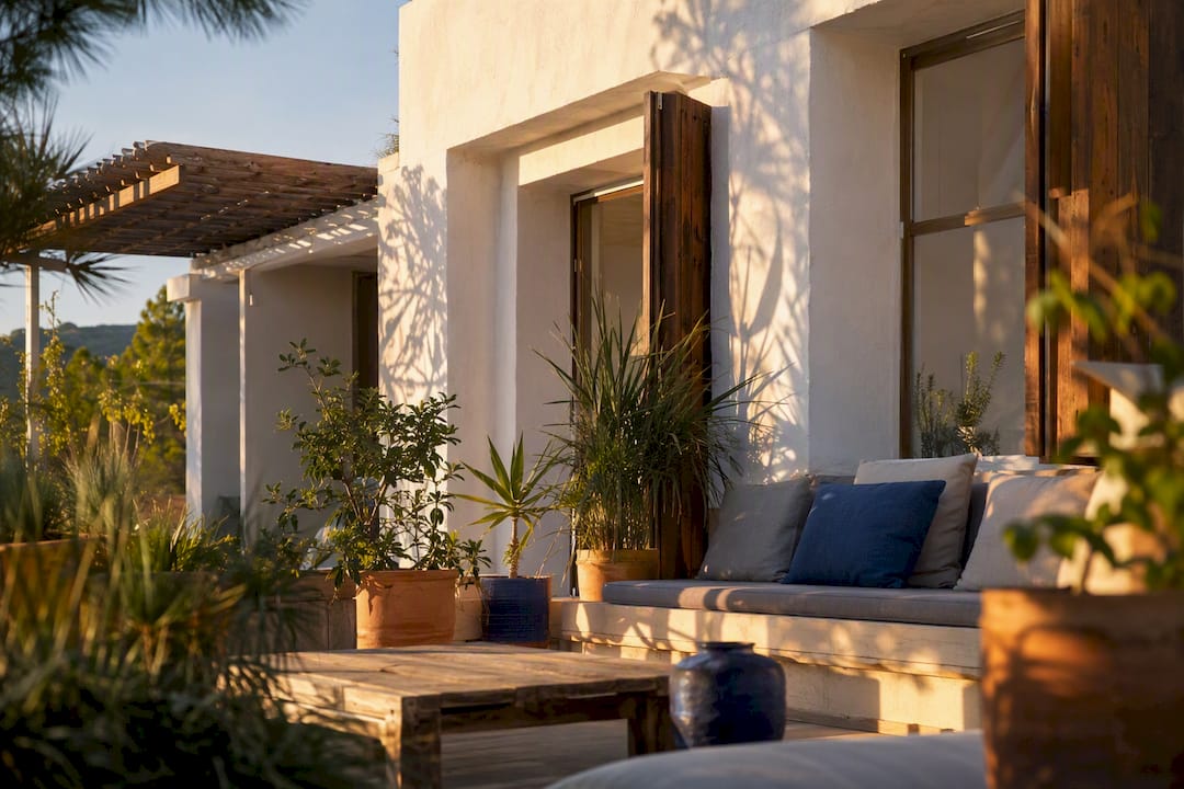 Shaded terrace with shutters demonstrating passive cooling