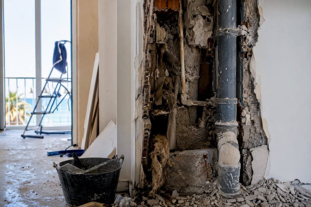 Exposed defects behind renovation wall