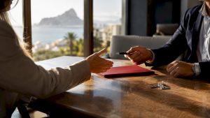 Buyer and adviser negotiating Spanish property offer